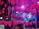 A bunch of pink and red heart shaped balloons hanging from the ceiling.