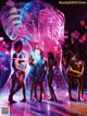 A group of naked women standing in front of a giant bubble.