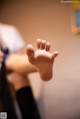 A close up of a person's foot with a blurry background.